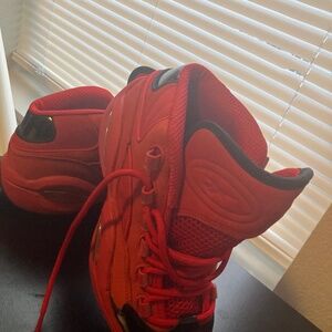 Red and black Reebok shoes.